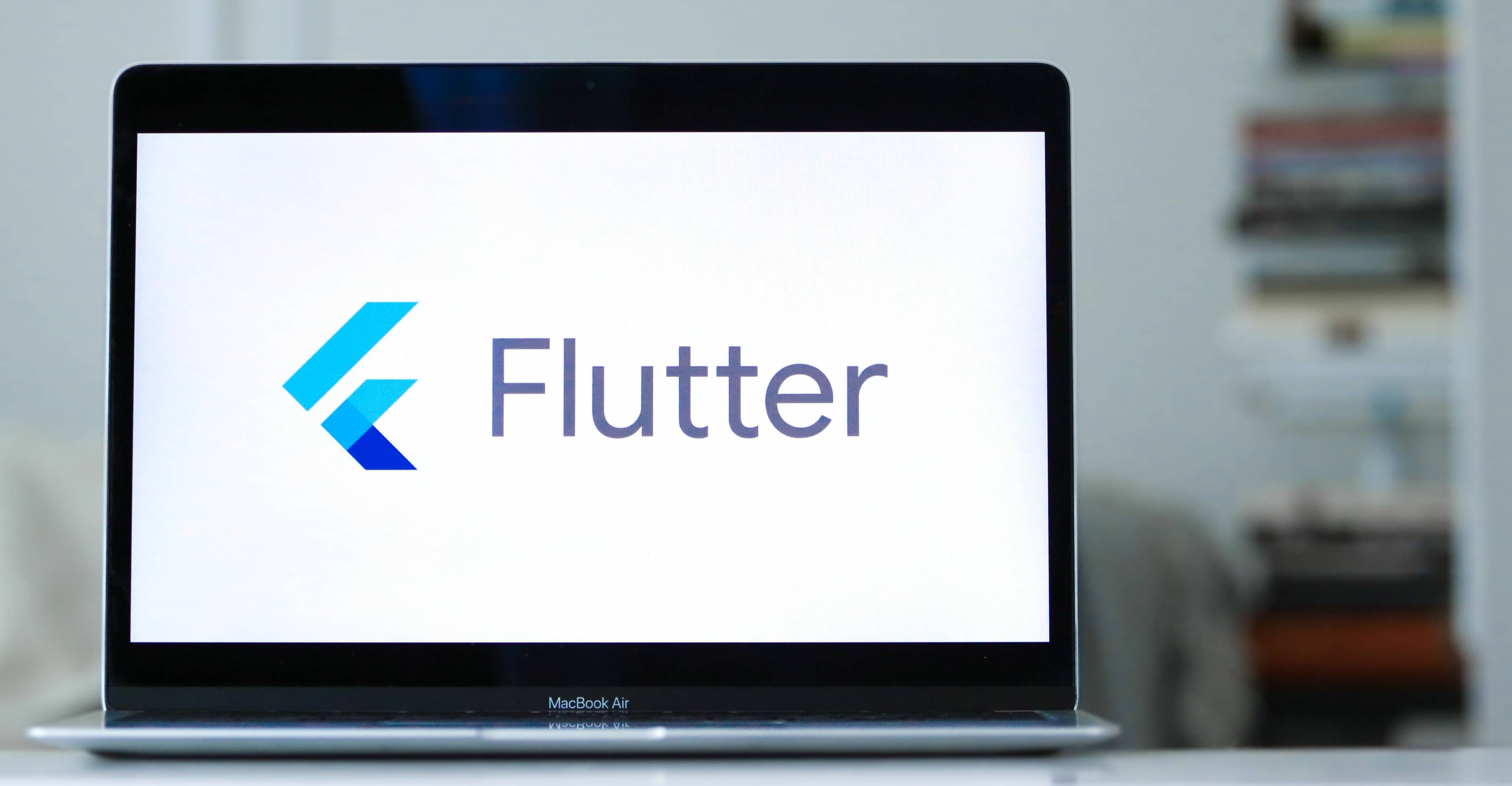 Laptop with Flutter logo on it