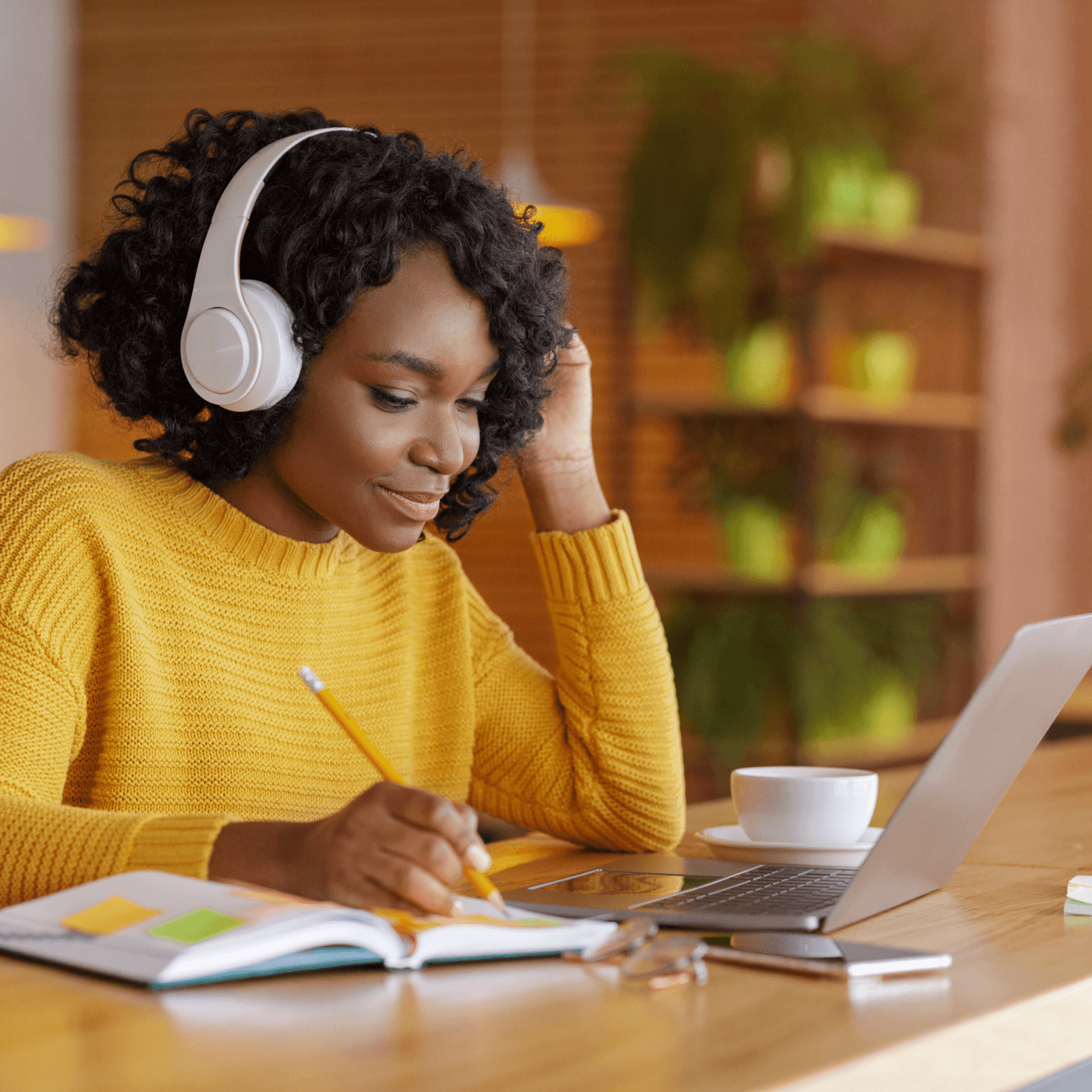 A Person using headphones with a laptop