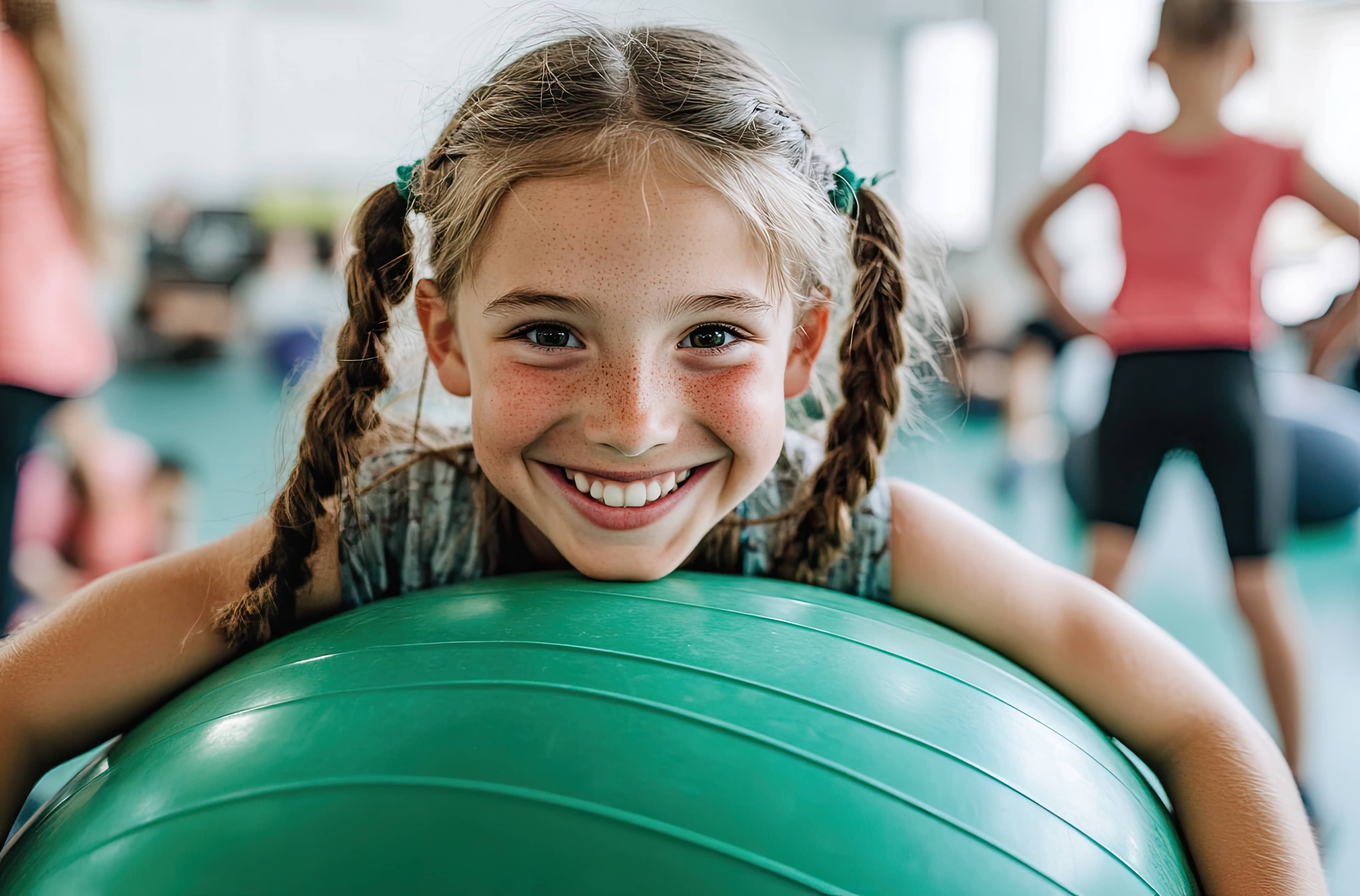 Child with an exercise ball