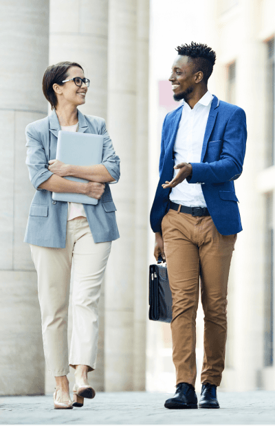 DMA Grid 1 two people walking and talking about business